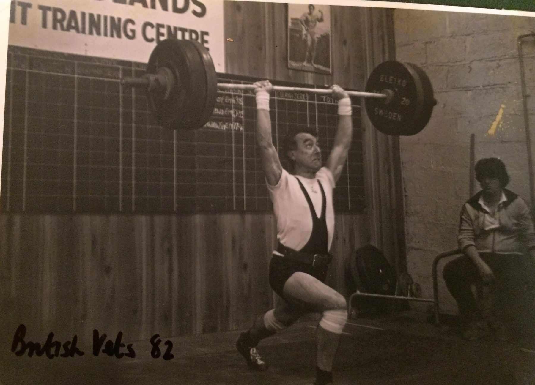 Brian jerking a barbell at the British Veterans, 1982